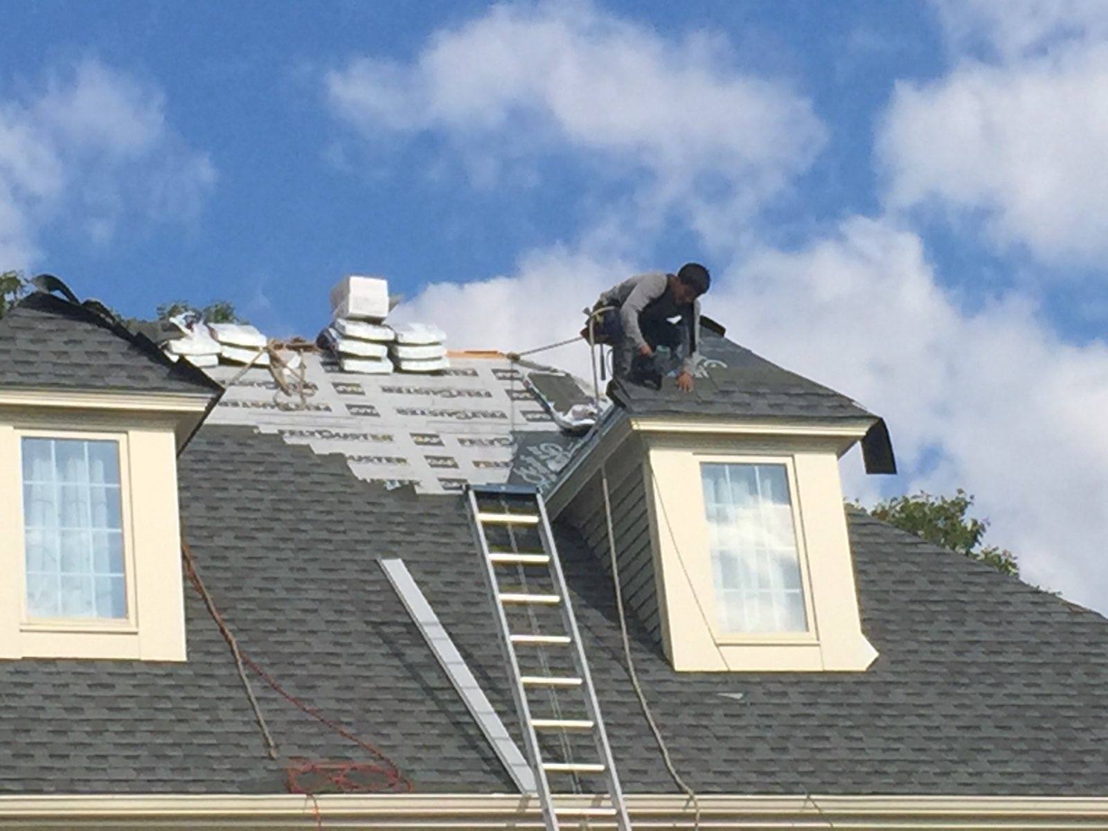 evangelous roofing company working on roof repair